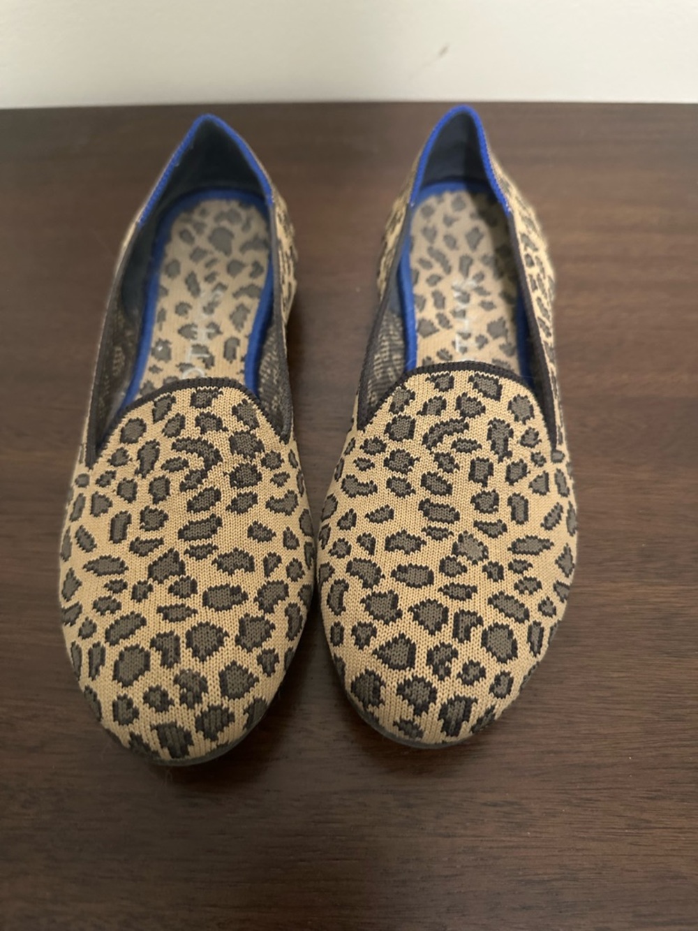 Rothy's Leopard Print Slip-On Flats in Tan and Black with Blue Trim